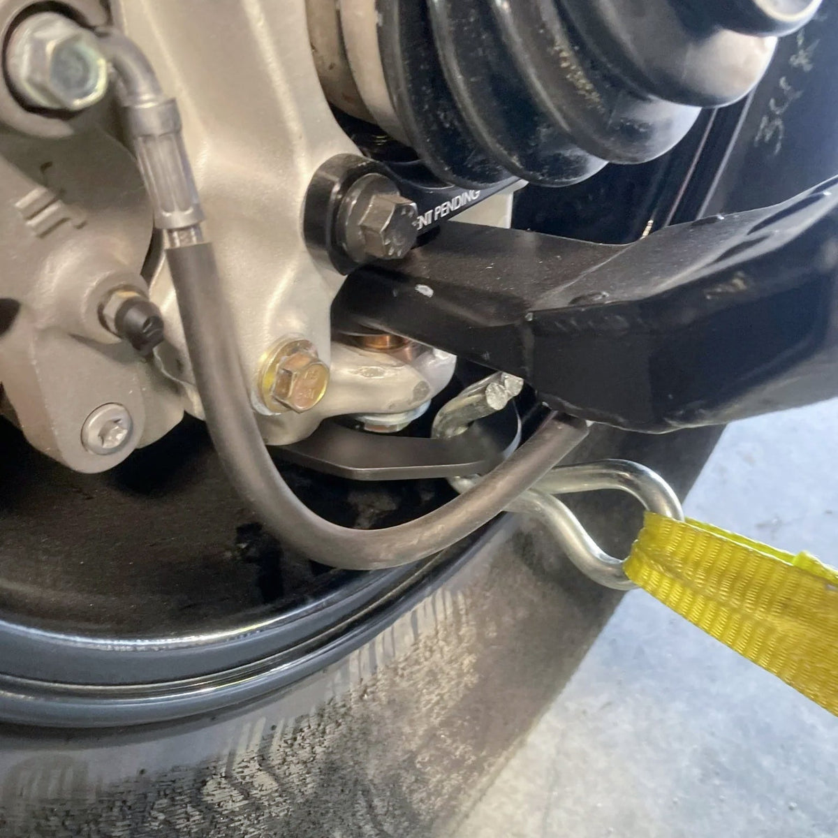 Evolution Powersports - Suspension - SHIFT Performance Labs Width Reduction Suspension Tie Down Kit for Can-Am Maverick R